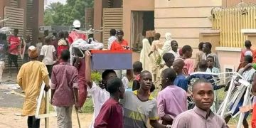 Photo Story: Hoodlums Loot, Burn Nigerian Communications Commission Office In Kano Amid Protests